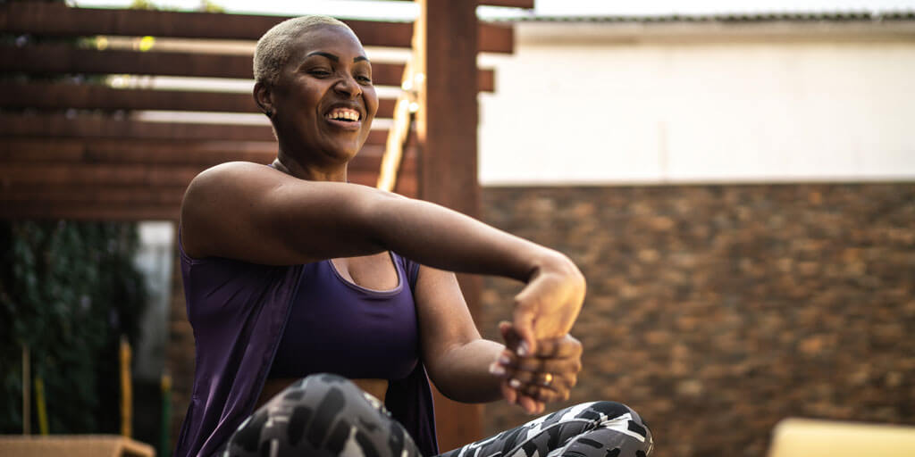 Woman stretching in a seated yoga pose