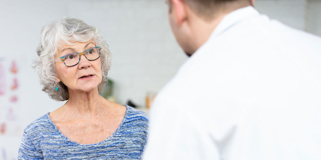 50+ woman talking with her doctor